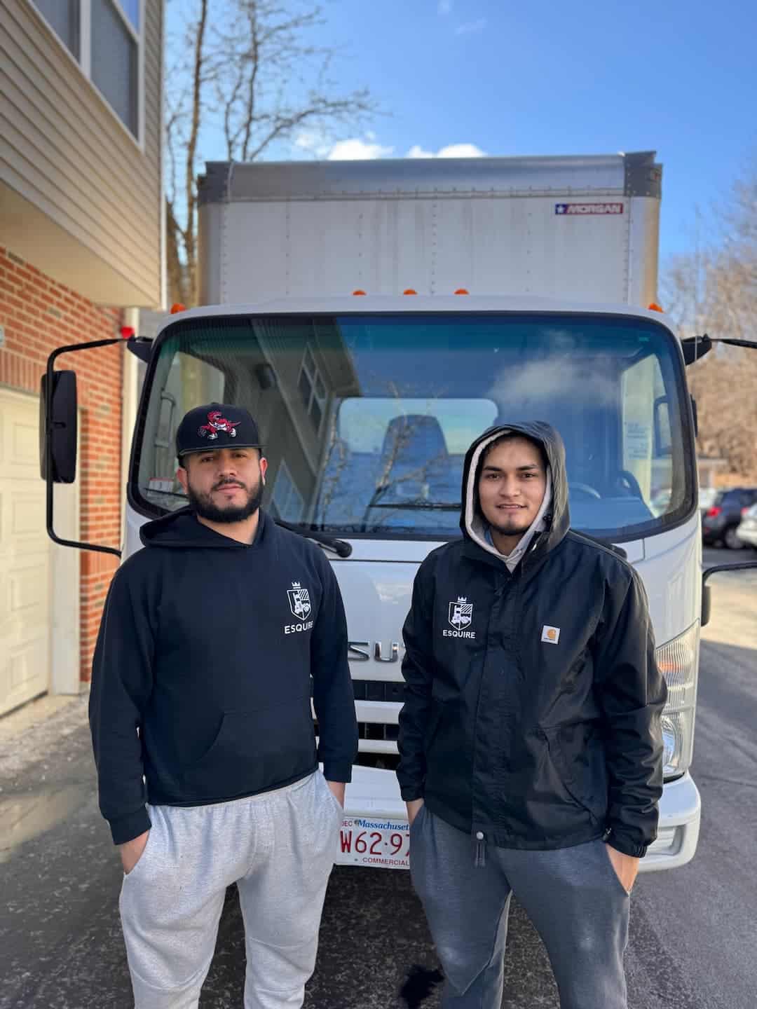 Esquire Moving crew prepared beside a moving truck